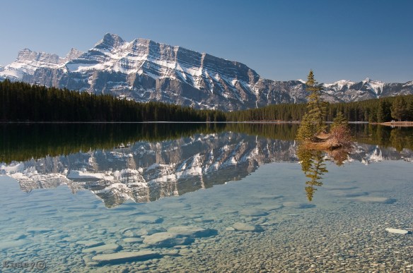 clear water Two Jack Lake reflecting rocky mountains