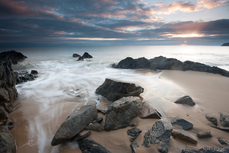 Tropics far north queensland rocks sunrise beach ocean sunrays