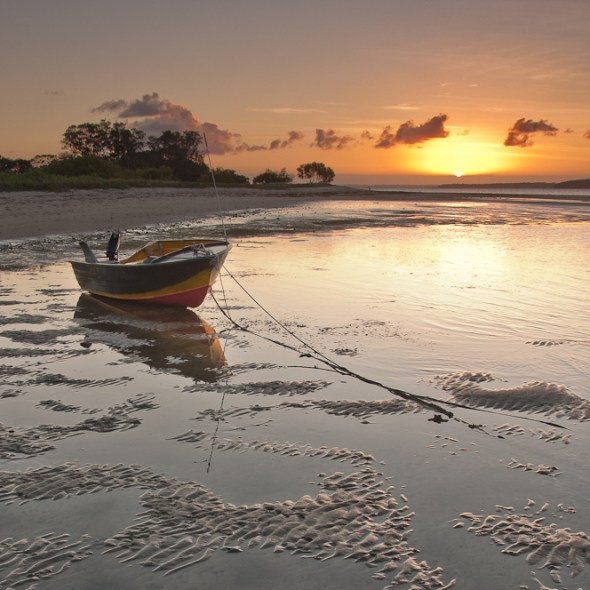 grounded boat anchored sunset Morton Bay